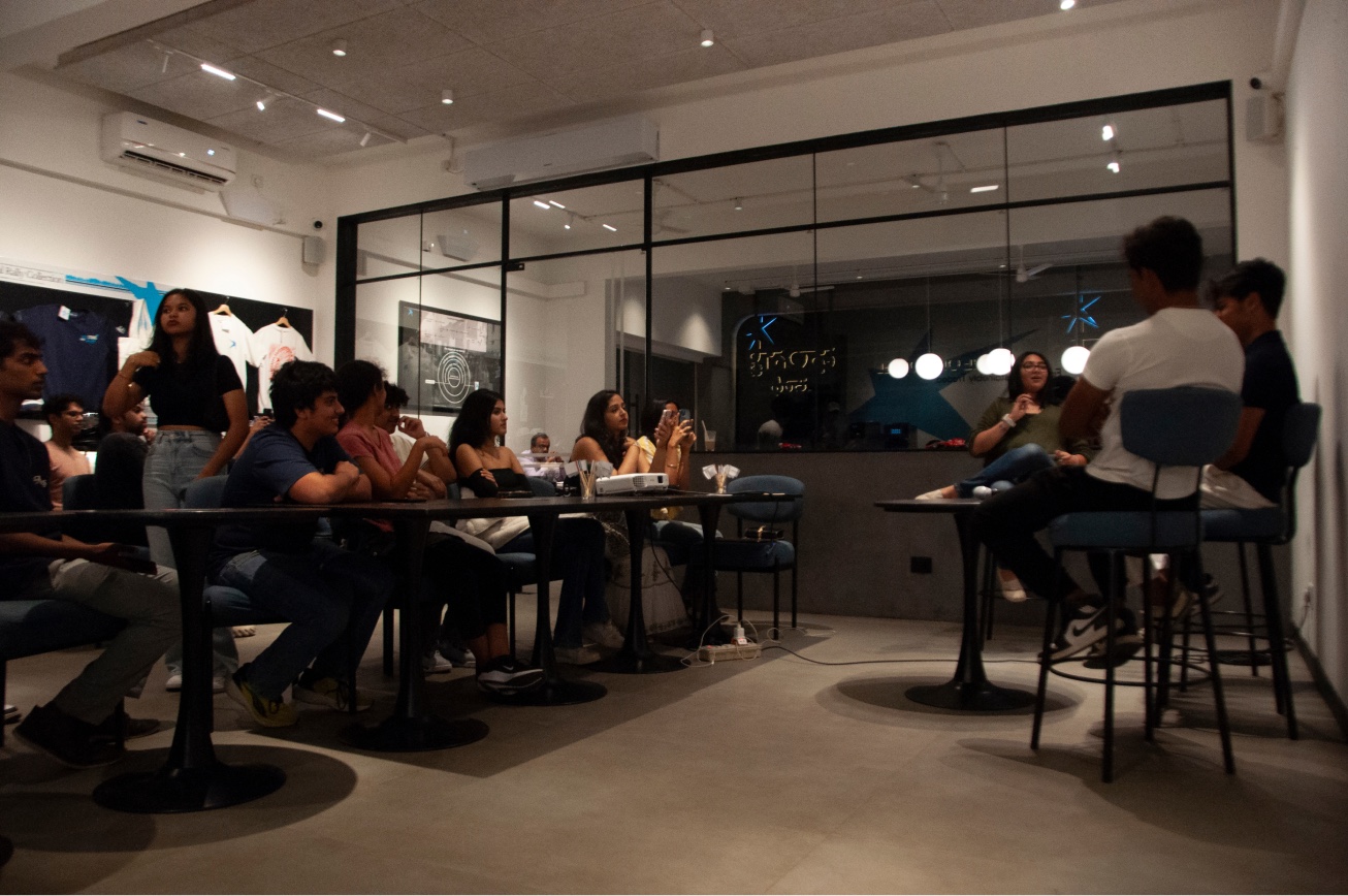 Guests seated at tables during the Grid to Grind watchalong.